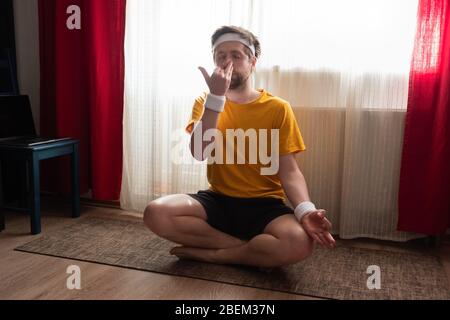 man making Alternate Nostril Breathing exercise, nadi shodhana pranayama Stock Photo