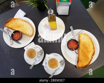 https://l450v.alamy.com/450v/2bem3e7/spanish-breakfast-cup-of-coffee-olive-oil-tomato-and-toast-view-from-above-spain-2bem3e7.jpg