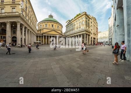 MILAN, ITALY - AUGUST 01, 2019: Tourists and locals walk in the center of Milano. Shops, boutiques, cafes and restaurants. Stock Photo