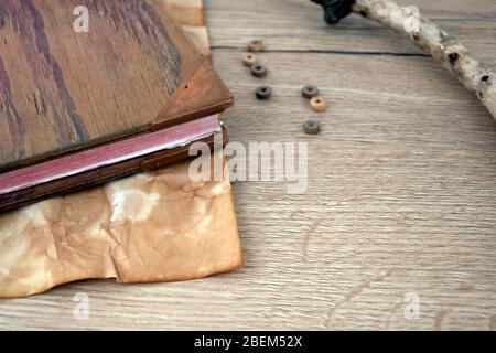 Rustic wooden book with old paper on wooden board, browns Stock Photo