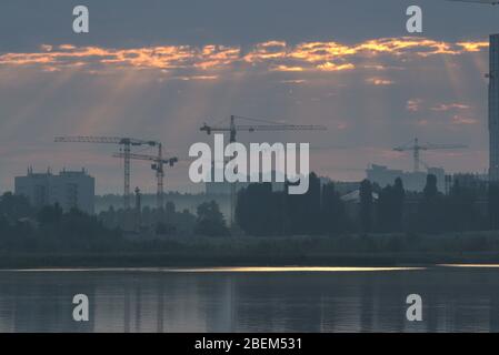 reconstruction of the city after the disaster, working cranes Stock Photo