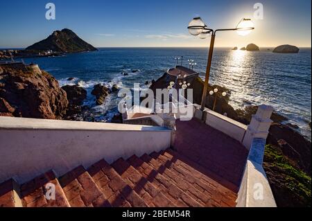 A view of the lighthouse, islands and many walkways along famous malecon and Paseo del Centenario of Mazatlan, Sinaloa, Mexico Stock Photo