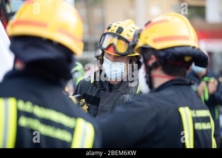 Malaga, Spain. 11th Apr 2020. Covid-19 Tribute applause to health personnel of the Hospital Carlos Haya Málaga from police, Guardia Civil and Firemen