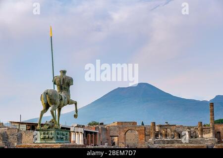 Pompeii ruins, Pompeii Forum - Centauro, bronze statue by Igor Motoraj, Mount Vesuvius on background, ancient city of Pompeii, Italy, Europe. Stock Photo