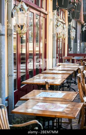 Empty chairs and tables outside a restaurant bar in the town of Veenendaal, the Netherlands, which was forced to close due to the coronavirus outbreak Stock Photo