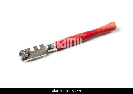 Glass cutter with a red wooden handle isolated on white Stock Photo