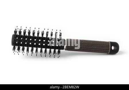 Black plastic cylindrical massage comb isolated on white Stock Photo