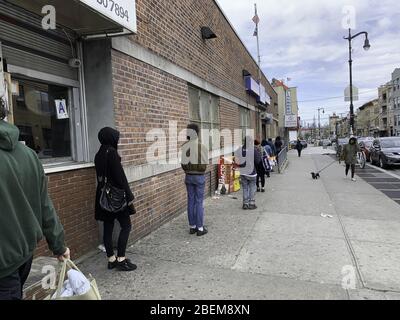 International, Brooklyn/New York, USA. 14th Apr, 2020. (NEW) Covid-19:Movement in Brooklyn. April 14, 2020, Brooklyn, New York, USA:There is long queue everywhere in Brooklyn to enter post office, stores amid Coronavirus pandemic.People are also keeping distance while on the queue. Credit: Niyi Fote/Thenews2 Credit: Niyi Fote/TheNEWS2/ZUMA Wire/Alamy Live News Stock Photo