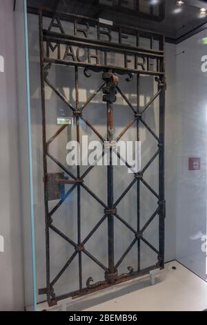 An original camp gate with 'Arbeit macht frei' (from 1936) on display inside the former Nazi German Dachau concentration camp, Munich, Germany. Stock Photo