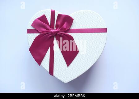 Red heart shape gift box isolated on white. Stock Photo