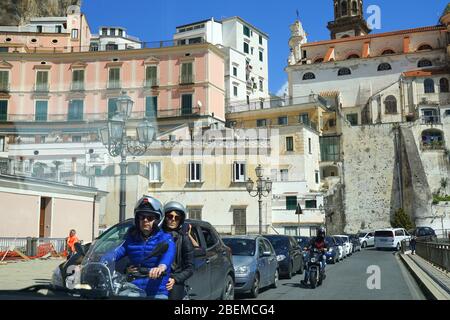 Traffic with backdrop of colorful buildings Amalfi Coast, Italy Stock Photo
