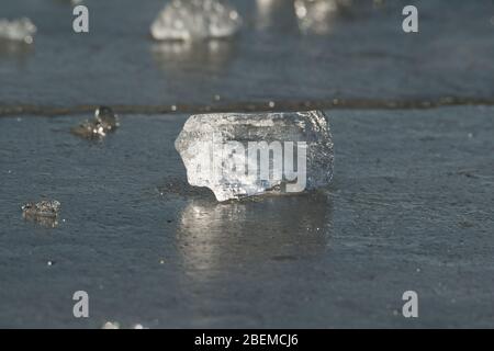 Broken ice pieces on water in the frozen river Background. Stock Photo