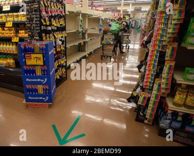 Doylestown, United States. 14th Apr, 2020. Am arrow directs traffic in an aisle as employees and customers follow safety protocols to help avoid coronavirus Tuesday, April 14, 2020 at ACME Market in Doylestown, Pennsylvania. Credit: William Thomas Cain/Alamy Live News Stock Photo