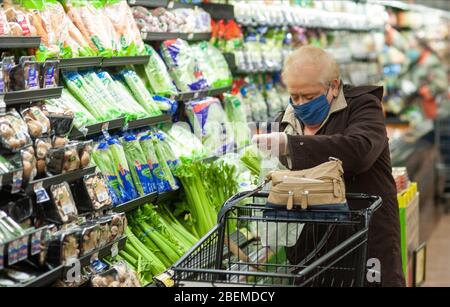 Doylestown, United States. 14th Apr, 2020. Barbara Petrone shops for celery as employees and customers follow safety protocols to help avoid coronavirus Tuesday, April 14, 2020 at ACME Market in Doylestown, Pennsylvania. Credit: William Thomas Cain/Alamy Live News Stock Photo