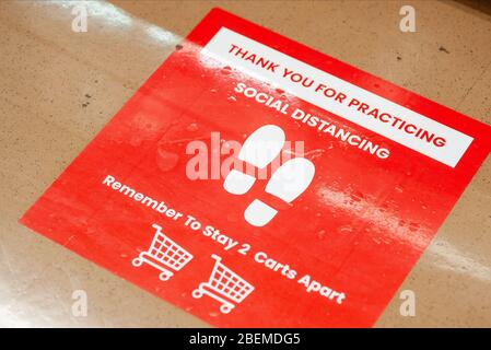 Doylestown, United States. 14th Apr, 2020. A sign on the floor advises employees and customers follow safety protocol to help avoid coronavirus Tuesday, April 14, 2020 at ACME Market in Doylestown, Pennsylvania. Credit: William Thomas Cain/Alamy Live News Stock Photo