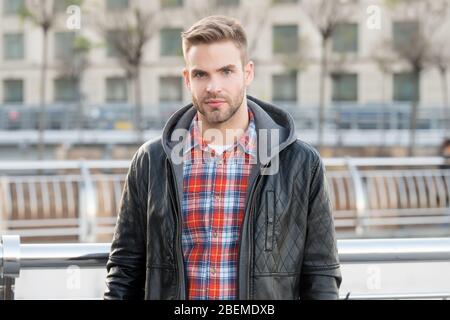 In his own style. Handsome guy in autumn style. Caucasian man on urban outdoors. Fashion style. Urban lifestyle. His style is a lot more casual. Stock Photo