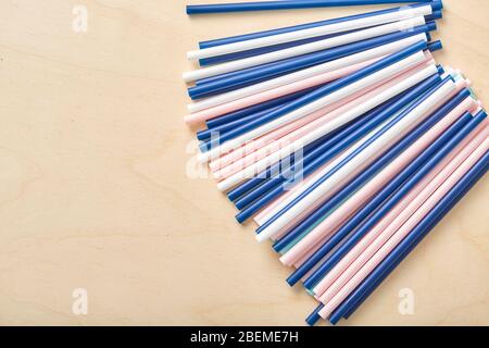 Drinking straws for party on wooden background. Top view Stock Photo