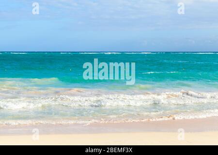 Coastal Caribbean Sea landscape with sandy coast and waves. Atlantic ocean coast, Dominican republic. Bavaro beach