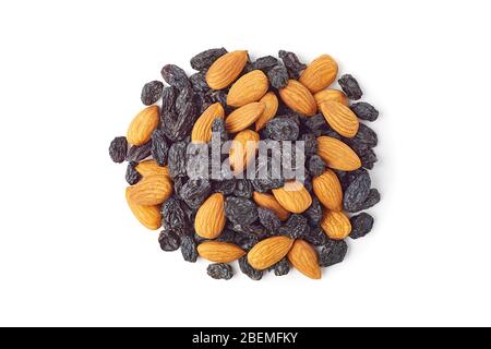Heap of almonds and black raisins on white Stock Photo