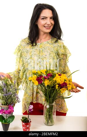 Cheerful shop flower woman isolated on white background Stock Photo