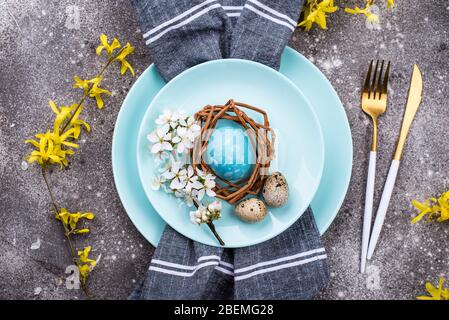 Easter table setting with blue egg Stock Photo