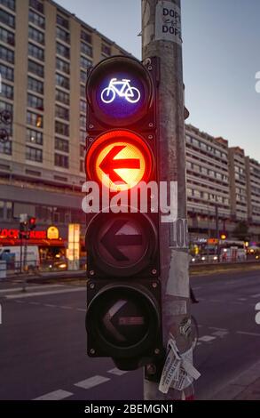 Berlin, Germany - June 30, 2018: Night shot of a bicycle traffic light in the city center of Berlin, in which the signal lights red. Stock Photo