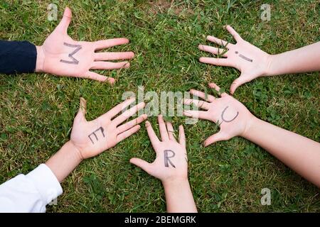 Word merci  on child hands Stock Photo