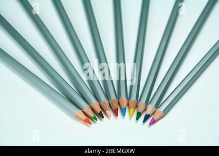 Colored pencils on a white background top viewed Stock Photo