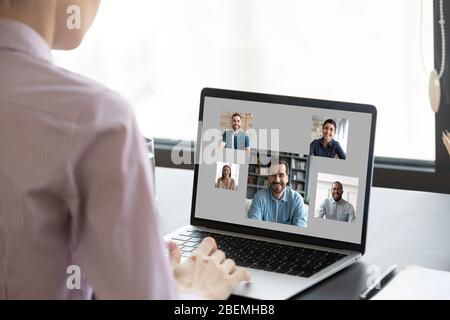 Woman looking at laptop screen participating in group videocall concept Stock Photo