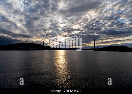 Sunset at Askoey (Askøy) suspension bridge outside port of Bergen, Norway. Stock Photo