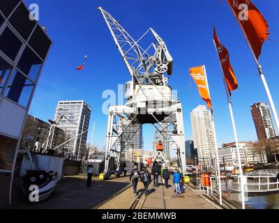 naval maritime museum with ships and boats on water in the river at the port of rotterdam in netherlands Stock Photo