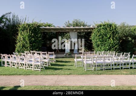 Wedding arch. Rustic wedding. Wedding area covered with flowers. Stock Photo