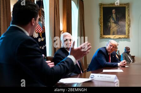 Former football player Mark Campbell, Michigan makes remarks about his bout with Coronavirus with United States President Donald J. Trump and US Vice President Mike Pence looking on as he meets with recovered COVID-19 patients in the Cabinet Room, Tuesday April 14, 2020. Credit: Doug Mills/Pool via CNP | usage worldwide Stock Photo