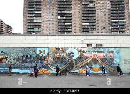 Brooklyn, United States. 14th Apr, 2020. People wait on line to enter a super market wearing protective face masks and practicing social distancing in New York City on Tuesday, April 14, 2020. As of today nearly 285,000 have been infected with Coronavirus and more than 14,000 people have died in NY, NJ and CT. There are signs however that the curve is flattening. Photo by John Angelillo/UPI Credit: UPI/Ģ����ý Live News Stock Photo