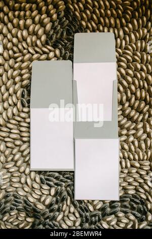 Enter plain white paper in the envelope. The paper is empty and the desired text can be written. Invitations, greetings, celebration cards. Stock Photo