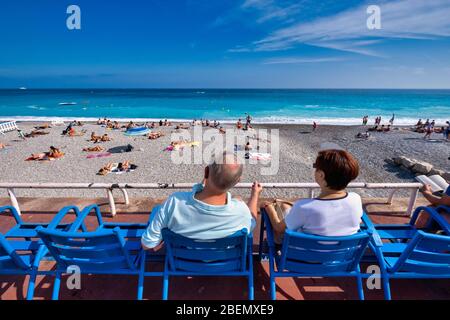 People enjoying the sun at the Promenade des Anglais in Nice, France, Europe Stock Photo