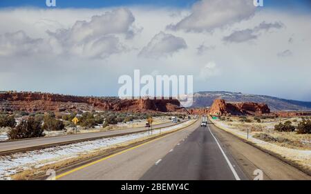 Straight, flat road in the with highway in New Mexico Stock Photo