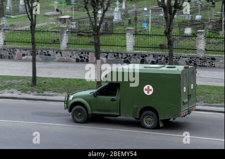 RIVNE, UKRAINE - APRIL 14, 2020. Mmilitary ambulance in the city Stock Photo