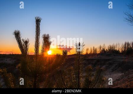 Sunset against the backdrop of large obese clouds.  Stock Photo