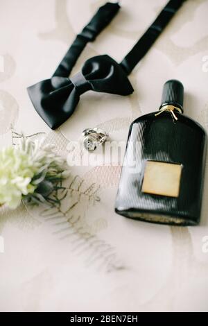 Groom accessories. Bow tie, boutonniere, seat and bow tie. Indoor and close-up. Stock Photo