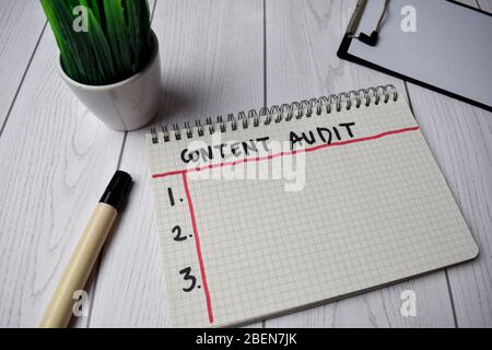Content Audit write on a book isolated on Office Desk Stock Photo