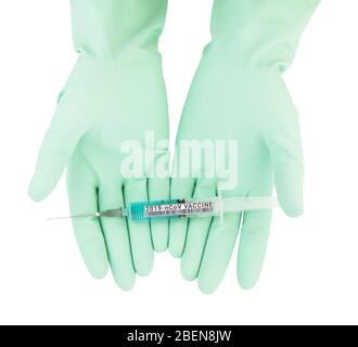 Medical personnel’s hands in gloves holding a syringe with coronavirus vaccine Stock Photo