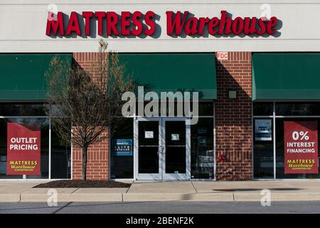 A logo sign outside of a Mattress Warehouse retail store location in Columbia, Maryland on April 6, 2020. Stock Photo