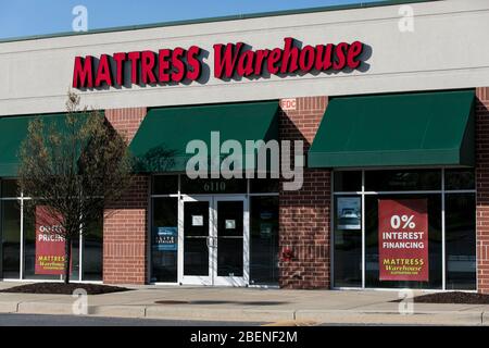 A logo sign outside of a Mattress Warehouse retail store location in Columbia, Maryland on April 6, 2020. Stock Photo