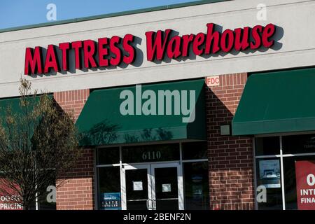 A logo sign outside of a Mattress Warehouse retail store location in Columbia, Maryland on April 6, 2020. Stock Photo