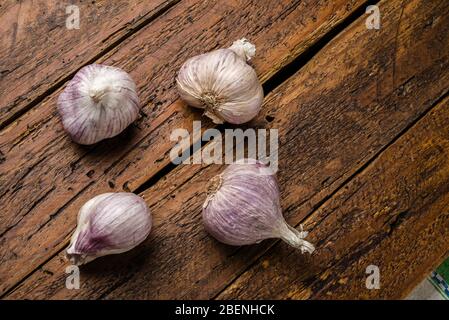 Top view fresh organic garlic on wooden table top Stock Photo