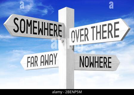 Wooden white signpost with four arrows, sky Stock Photo