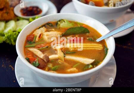 Thai traditional sour soup Tom Yam in vegetarian variation in vegan restaurant in Bangkok Stock Photo