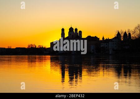 Cityscape of Passau with famous St. Stephan'c Cathedral at the confluence of Danube, Inn and Ilz at dusk Stock Photo