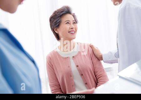 The doctor talked with elderly patients Stock Photo